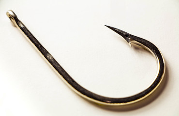 Old rusted fishing hook isolated on a white