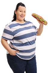 Overweight woman with a sandwich