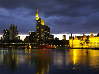 Fototapeta na wymiar Skyline and River Main at Night in Frankfurt am Main, Hesse, Hessen, Germany, Europe, 22. May 2007