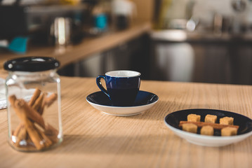 Mug of delicious beverage situating on table