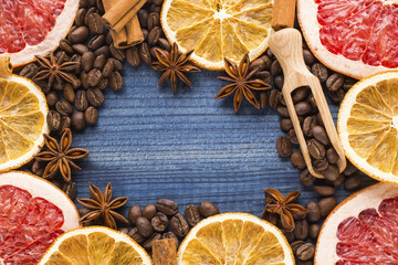 citrus slices and spices on wooden background