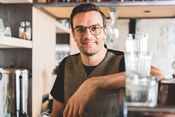 Fototapeta premium Beaming male having job in cafe