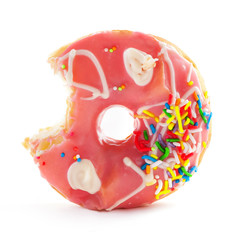 Strawberry donut with colorful sprinkles isolated on white.