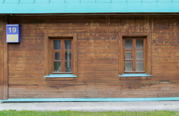 Detail of an old house with unusualy wooden windows