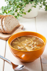 Traditional polish tripe soup with vegetables.