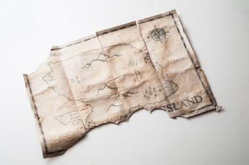 Close up to vintage map with fake island of Pirates treasure