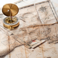 Fototapeta na wymiar Abstract background of mixed grunge vintage fake treasure maps with compass