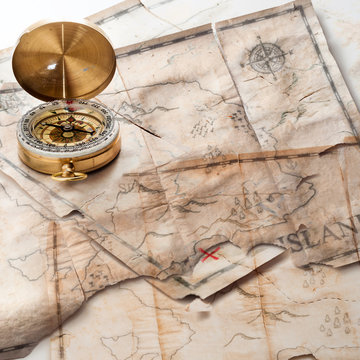 Abstract background of mixed grunge vintage fake treasure maps with compass