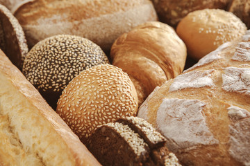 Bread background, closeup of white, black and rye loaves