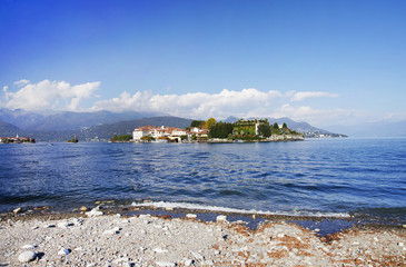 Isola Bella seen from the beach of Stresa town. The island  is divided between the Palace, the Italianate garden, and a small fishing village. Lago Maggiore, Italy, Europe