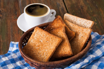 Breakfast background, toast and coffee on rustic wood