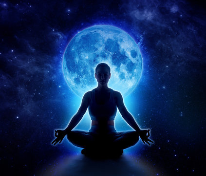 Yoga woman in full blue moon and star. Meditation girl sitting in lotus pose under moonlight in dark night sky, Moon original image from NASA.gov