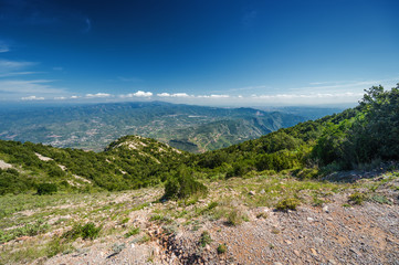 Sunny view of mountains of Santa Maria de Montserrat Abbey in Monistrol de Montserrat, Catalonia, Spain.