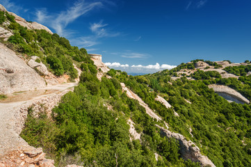 Sunny view of mountains of Santa Maria de Montserrat Abbey in Monistrol de Montserrat, Catalonia,...