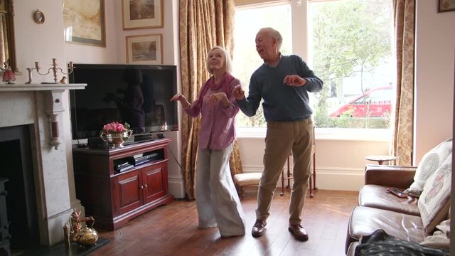 Senior Couple Dancing At Home