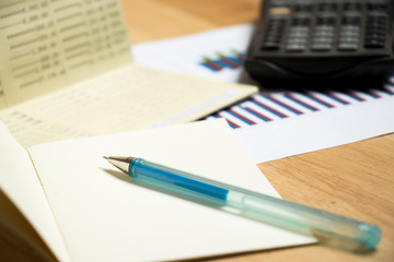 Background of passbook, note book with pen,calculator and financial graph