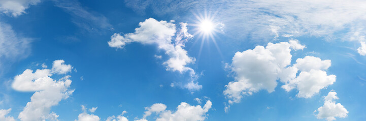 Blue sky with sun and clouds
