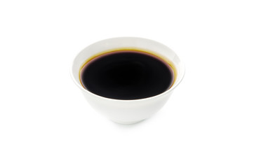Soy sauce in bowl isolated on white