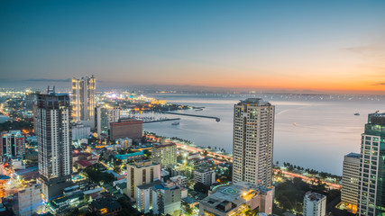 Beautiful Manila city shore Manila Bay skyline during sunset - obrazy, fototapety, plakaty