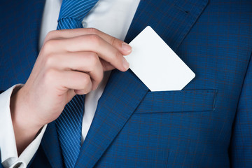 paper credit card in hand of office man, business ethics