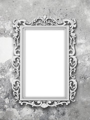 Blank Baroque picture frame on gray concrete wall