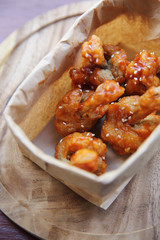 Buffalo wings on wood background