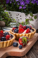 Fresh homemade fruit tart with strawberries and blueberries.