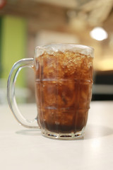 Coca Cola glass on the food table.
