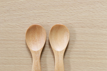 Empty wooden spoon on wood floor.