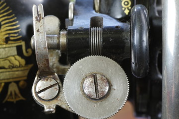 Macro photo of sewing machine parts. Device for winding thread on the spool.