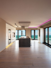 Interiors of a modern apartment, kitchen with sea view