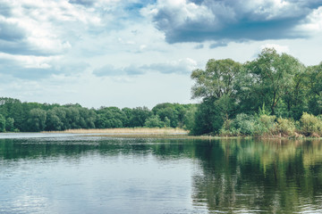 Beautiful spring natural landscape: river, trees 