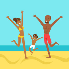 Happy mother and father with their son jumping together on a beach