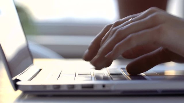 female hands using computer laptop. Vintage filter