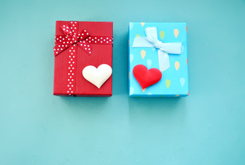 Gift boxes and hearts on a blue background 