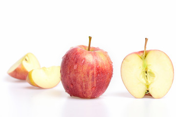 fruit slice of red color apple isolated on white background