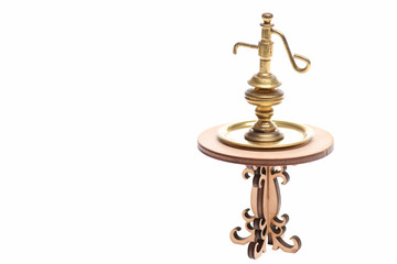 Fototapeta na wymiar Ancient golden lamp on tray on decorative wooden table