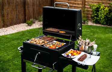Barbecue grill party. Tasty Fresh food. Shrimps  spit and Beef rolls with bio young spices, chicken strips. bio vegetables