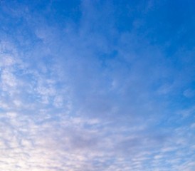 Light blue sky cloudy blurry background. Blurred sky design. Nature summer abstract blur. Bokeh gradient pastel. Sunshine morning fluffy white clouds. Copy space.