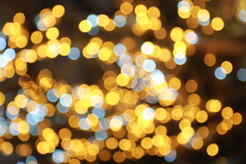 Color Blurred background : Bokeh lighting in concert with audience , texture dot copy space,music performance concert with bokeh spotlight. entertainment concert lighting on stage,blurred disco party.