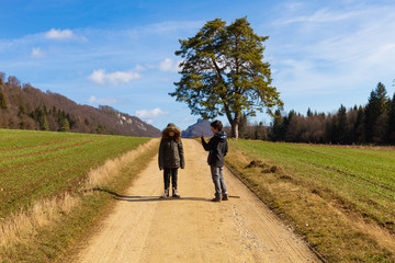 Obraz premium Children in nature, agricultural landscape, fields in autumn