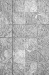 Fototapeta premium Closeup surface brick pattern at brick stone wall textured background in black and white tone