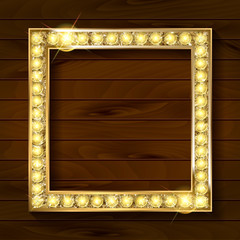 Gold frame on wooden background