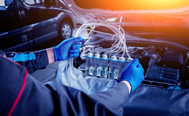 Cleaning engine injectors. Car repair.