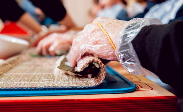 Children prepare sushi and rolls