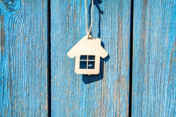 The symbol hanging on blue wooden background 