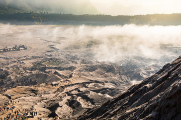 View from above to see a lot of tourists, the way to Bromo have the sea mist with sunrise located in Bromo Tengger Semeru National Park, East Java, Indonesia.