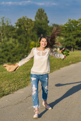 Young woman walking cheerful and relaxed by the river