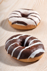 Two tempting fresh iced ring doughnuts
