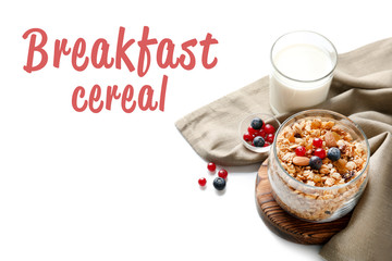 Glass of muesli with berries and text BREAKFAST CEREAL on white background